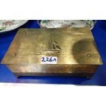 WMF; AN ARTS & CRAFTS BRASS CIGAR BOX, decorated with a yacht, 24cm wide