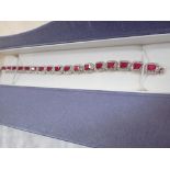 A RED AND WHITE GEM-STONE LINE BRACELET, the ring clasp stamped '925'