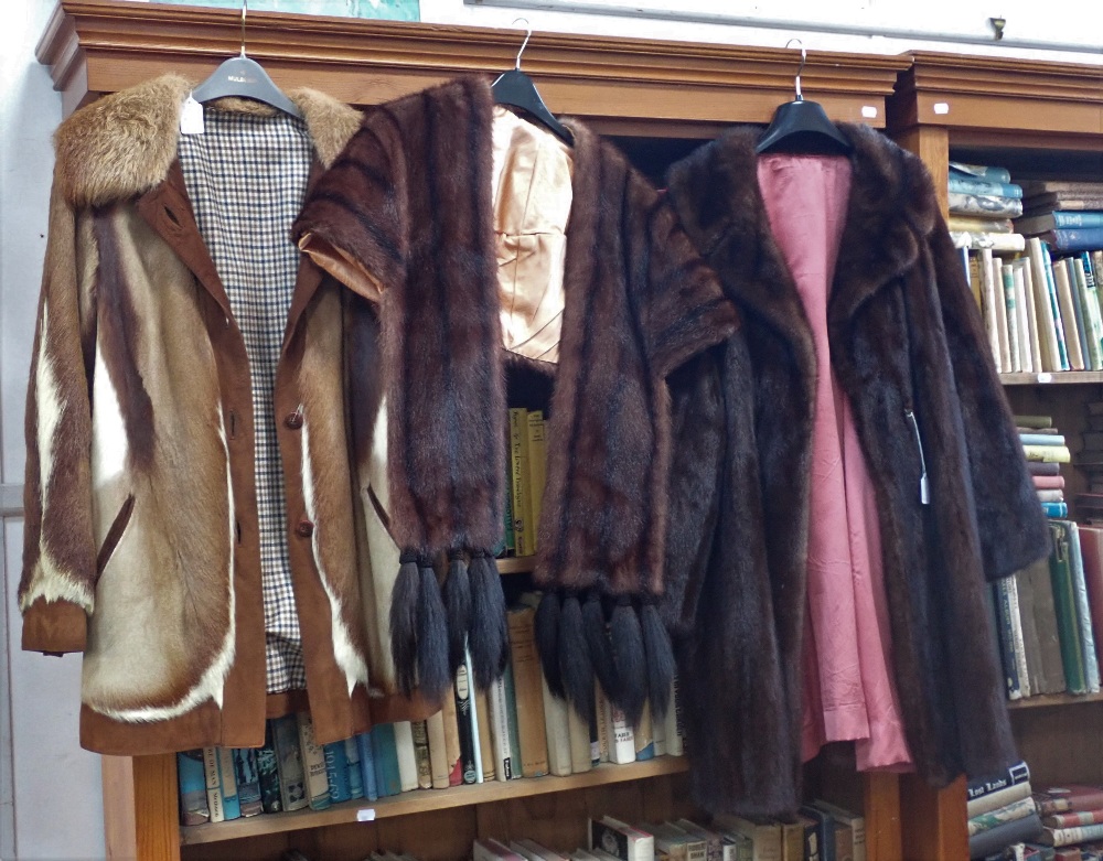 A VINTAGE LADIES BROWN FUR STOLE, a similar three quarter length coat and a suede and fur coat (3)