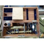 A MAHOGANY CASED BRASS AND JAPANNED STUDENT'S MICROSCOPE and some glass slides