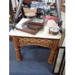 A COLONIAL STYLE RATTAN COFFEE TABLE with faux ivory top, 70cm square