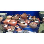 A LARGE COLLECTION OF MINIATURE CHINESE REDWARE TEAPOTS