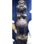 A CARVED TRIBAL FIGURE OF A PREGNANT WOMAN, possibly Fijian, 51cm high
