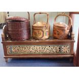 A CARVED AND PAINTED HARDWOOD CHEST with raised ends and openwork panels made from older