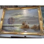 W F STEVENS: Mallards in flight over marshland, oil on canvas in gilt frame