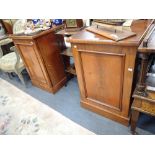 A PAIR OF 19TH CENTURY MAHOGANY CUPBOARDS with plain figured doors, each 52cm wide