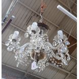 A SIX BRANCH GLASS CHANDELIER with glass droplets
