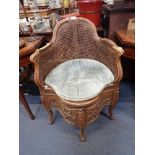 AN 18TH CENTURY FRENCH PROVINCIAL BEECH WOOD BERGERE NIGHT CHAIR with carved decoration and