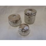 A SILVER TOPPED CUT GLASS DRESSING TABLE POTS (c.1.8oz) (3)