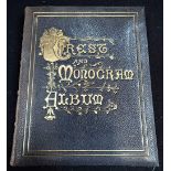 A VICTORIAN LEATHER AND GOLD EMBOSSED 'CRESTS AND MONOGRAM ALBUM'
