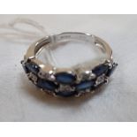 A SAPPHIRE AND DIAMOND DRESS RING, on a 18K white gold shank, ring size O
