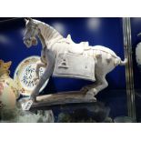 A LARGE TANG STYLE POTTERY PRANCING HORSE, 39 cm high, with thermoluminescence report confirming