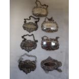 A COLLECTION OF SILVER AND METALWARE DECANTER LABELS, (7) (c1.2oz)