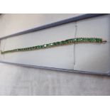 An Emerald line bracelet, set in overlay sterling silver, stamped '925'