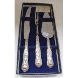 A SILVER-HANDLED CARVING KNIFE AND FORK AND PIE SERVER SET, boxed