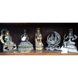 A CAST BRASS PATINATED BUDDHA and four other domestic shrines