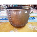 A LARGE 19TH CENTURY COPPER LOG BIN with brass handles, 55cm dia.