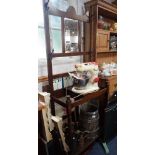 AN EDWARDIAN OAK HALL STAND with tiled back, 77cm wide