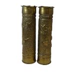 PAIR OF ARTS AND CRAFTS DECORATED BRASS TRENCH ART SHELLS and a brass trench art shell paperweight/l