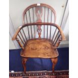 AN ASH AND ELM WINDSOR ELBOW CHAIR, early 19th century, with arched toprail, pierced splat, spindle