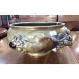 A CHINESE POLISHED BRONZE BOWL, decorated with vine leaves and grapes, 32cm wide (approx)