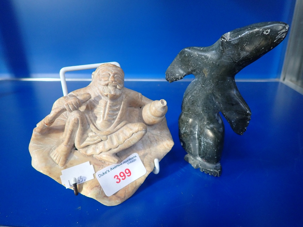 AN INUIT STYLE CARVING OF A POLAR BEAR and a soapstone study of a bearded man (2)