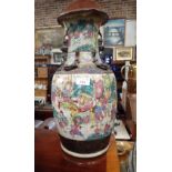 A LARGE CHINESE VASE, decorated with many warriors under a crackle glaze, 45cm high
