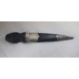 A SILVER MOUNTED SGIAN-DUBH