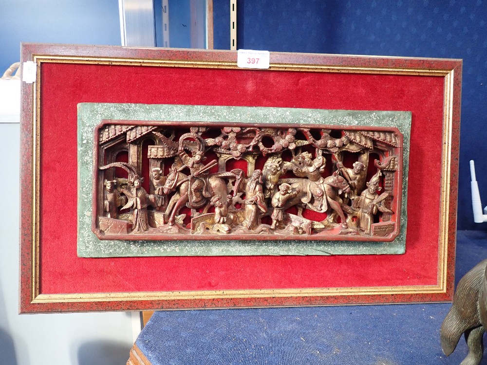 A CHINESE CARVED, LACQUERED AND GILDED PANEL, 18cm high x 40cm wide (plus later frame)