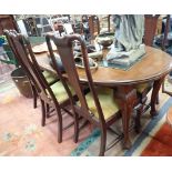 A QUEEN ANNE REVIVAL EXTENDING DINING TABLE AND SIX CHAIRS, the table 180cms long
