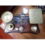 A SET OF VICTORIAN BRASS POSTAL SCALES with weights
