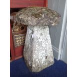 A STADDLE STONE ENCRUSTED WITH MOSS AND LICHEN, 77cm high
