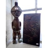 A TRIBAL BRASS COVERED FIGURE OF A MAN, with cowrie shell eyes and a cast plaque (2)