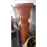 A PAIR OF NEO-CLASSICAL STYLE TERRACOTTA GARDEN URNS on column bases, each 113cm high