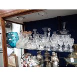 A GLASS FOOTED COVERED JAR with ladle and a collection of glassware