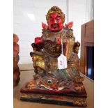 A CHINESE CARVED AND PAINTED WOOD MODEL OF A SEATED IMMORTAL, 30CM HIGH