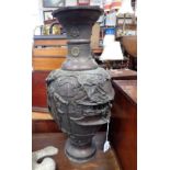 A LARGE JAPANESE BRONZE VASE, decorated with buildings and elders, 60cm high (examine)