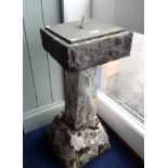 A SUN DIAL ON A RUSTICATED STONE BASE, 79cm high 'Time and Tide wait for no Man'