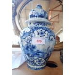A BLUE AND WHITE GLAZED POTTERY JAR AND COVER IN THE STYLE OF DELFTWARE, 26CM HIGH