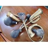A COLLECTION OF BRASS MOTOR CAR HORNS and a bike horn (4)