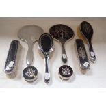 A COLLECTION OF SILVER AND TORTOISESHELL DRESSING TABLE ITEMS, including a part set with engraved de