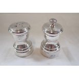 CARTIER: A PAIR OF STERLING SILVER SALT AND PEPPER SHAKERS, 6.5cm high (2)