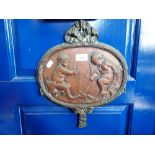 AN EDWARDIAN CAST BRONZE PLAQUE depicting two children within 'ribbon tied' decoration, 37cm high