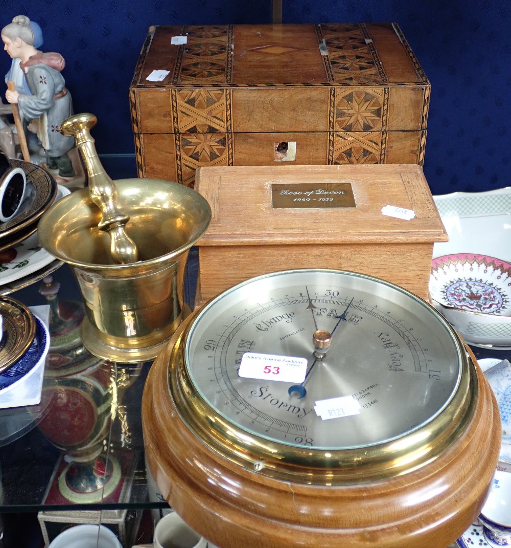 AN ANEROID BAROMETER by Negretti & Zambra, a cigarette box made from wood from, 'The Rose of Devon 1