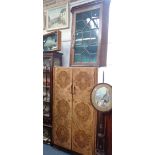 A MAHOGANY AND GLAZED DISPLAY CABINET ON STAND, early 20th century, with twin doors above a drawer,