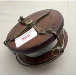 A MAHOGANY AND BRASS FISHING REEL, 11.5cm diam