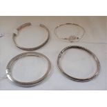 FOUR SILVER BANGLES, approximately 52gms