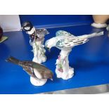 A PAIR OF 19TH CENTURY CONTINENTAL CERAMIC BIRDS and one other (3)