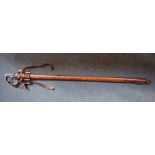 AN OFFICERS SWORD with metal hilt, black fish grip and original leather scabbard 98cm long
