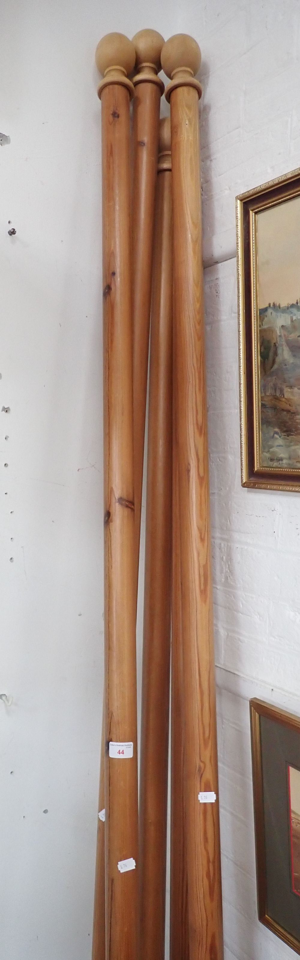 THREE PINE CURTAIN POLES, approx 240cm long with rings and brackets and another pair approximately 2